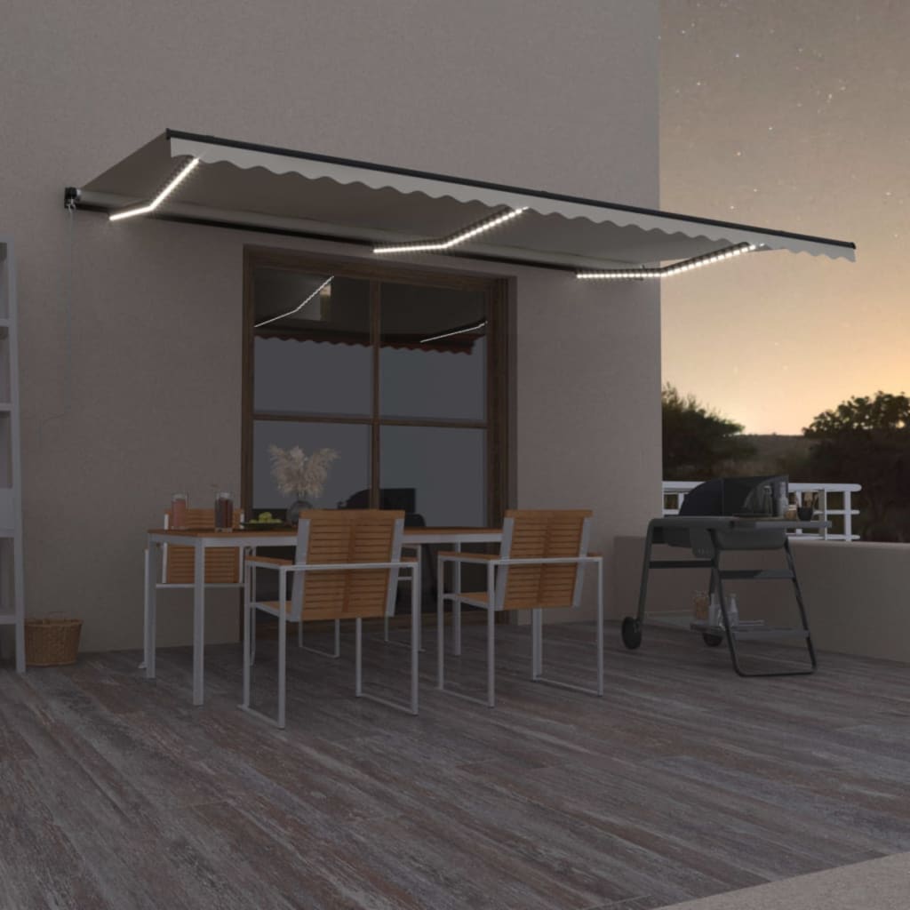 Manuaalisesti sisäänvedettävä markiisi LED-valoilla 600x300 cm kermanvärinen